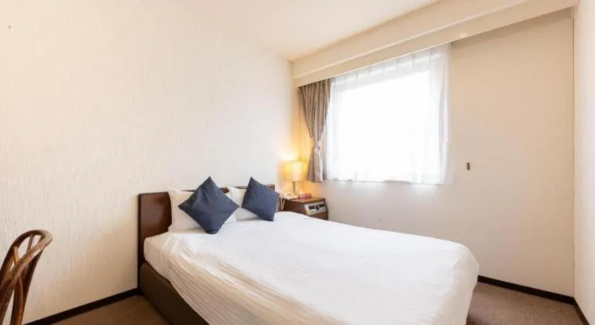 Bed in Tabist Yabuki Station Hotel