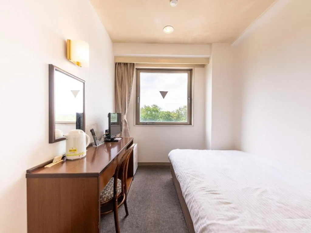 Bed in Tabist Yabuki Station Hotel