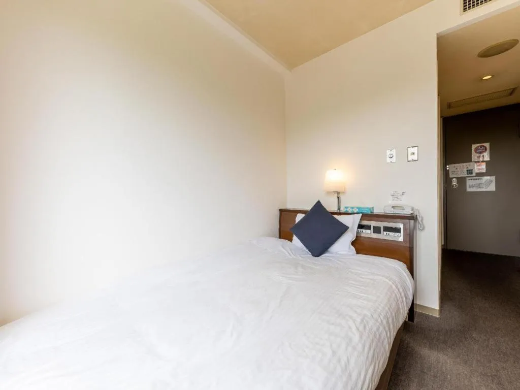 Bed in Tabist Yabuki Station Hotel