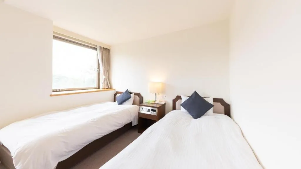 Bed in Tabist Yabuki Station Hotel