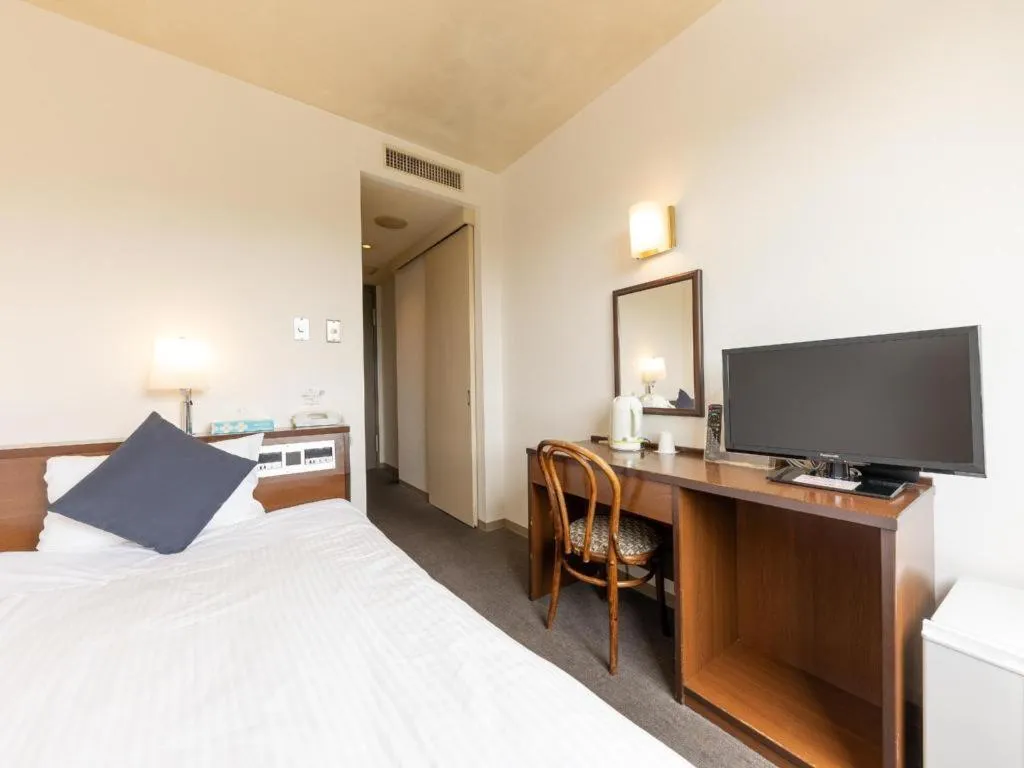 Bed in Tabist Yabuki Station Hotel