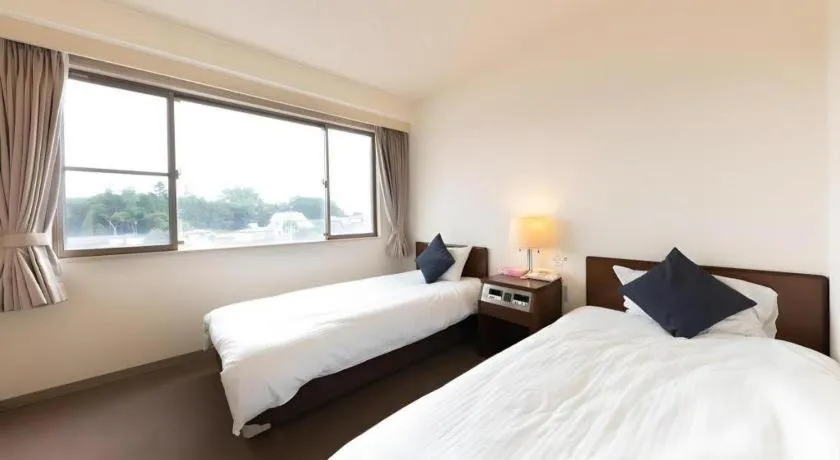 Bed in Tabist Yabuki Station Hotel