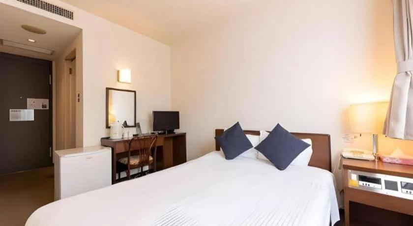 Bed in Tabist Yabuki Station Hotel