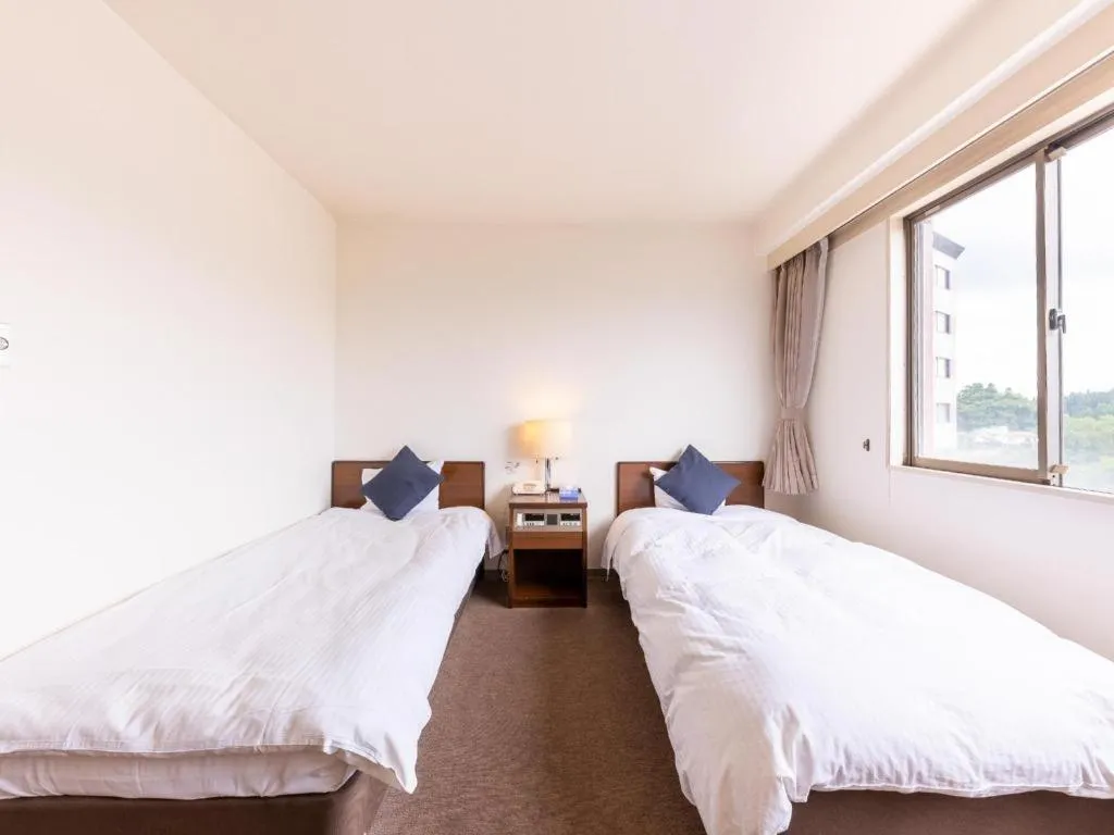 Bed in Tabist Yabuki Station Hotel