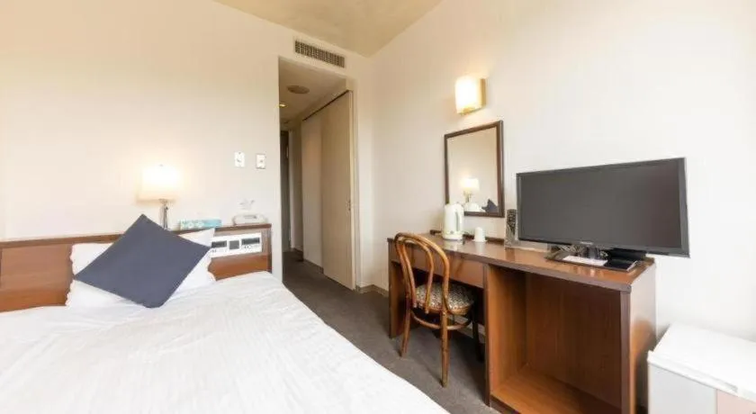 Bed in Tabist Yabuki Station Hotel