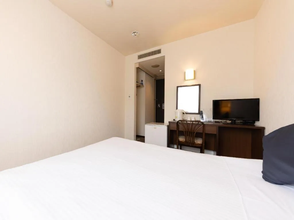 Bed in Tabist Yabuki Station Hotel