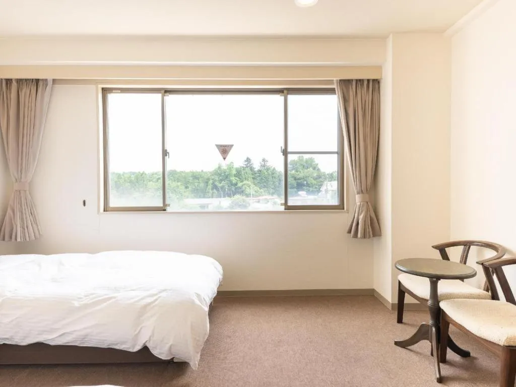 Bed in Tabist Yabuki Station Hotel