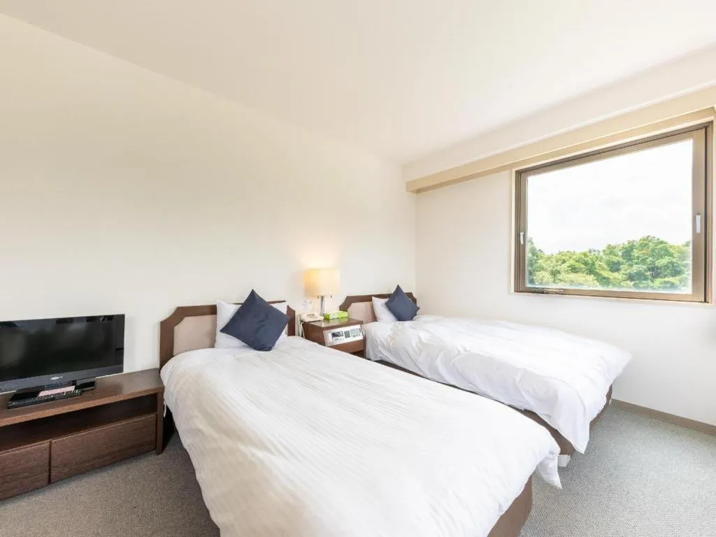 Bed in Tabist Yabuki Station Hotel