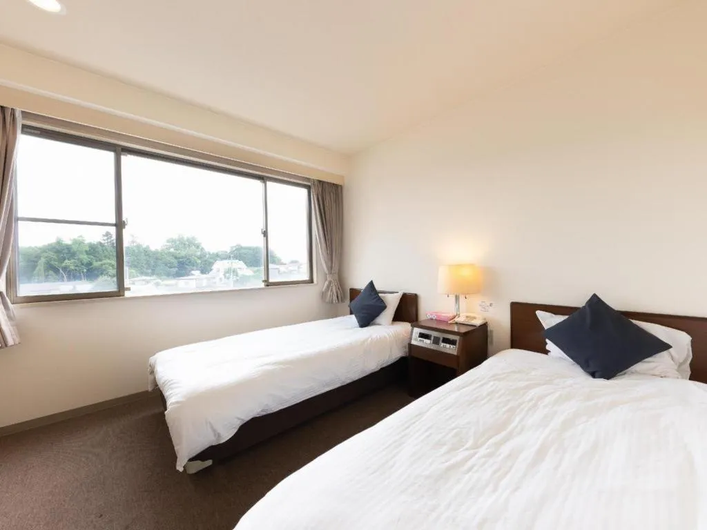 Bed in Tabist Yabuki Station Hotel