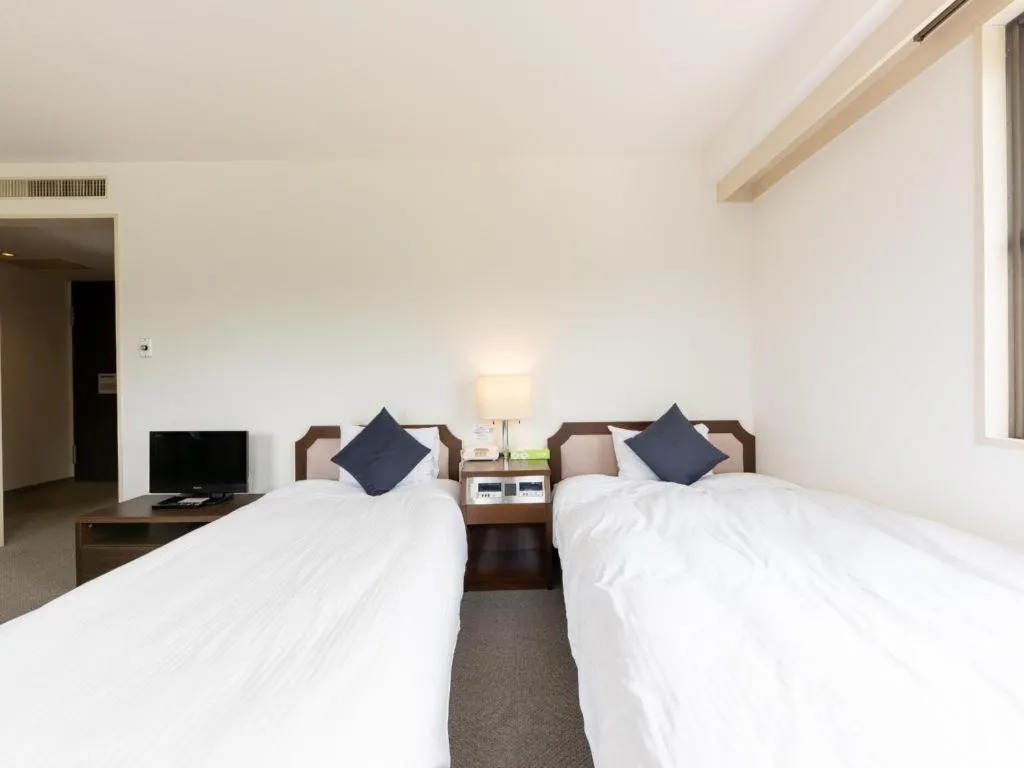 Bed in Tabist Yabuki Station Hotel