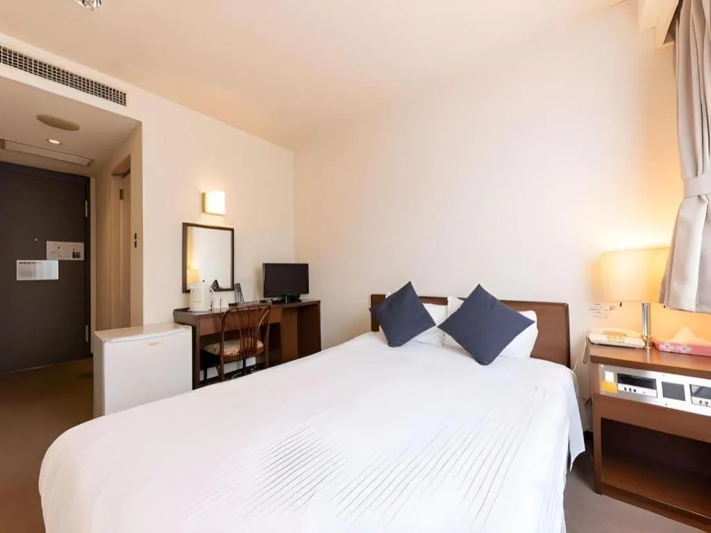 Bed in Tabist Yabuki Station Hotel