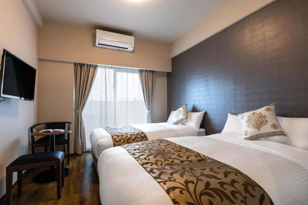 Bed in Mr.KINJO LINK in KUME NAHA Bed in Mr.KINJO LINK in KUME NAHA