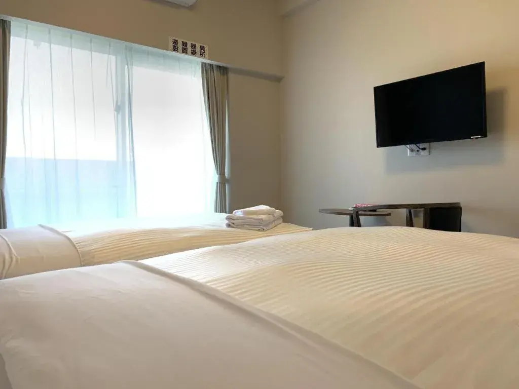 Bed in Mr.KINJO LINK in KUME NAHA Bed in Mr.KINJO LINK in KUME NAHA