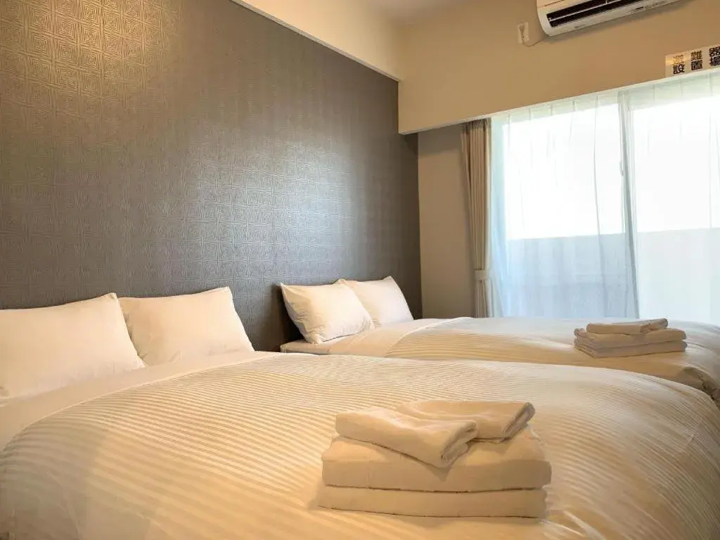 Bed in Mr.KINJO LINK in KUME NAHA Bed in Mr.KINJO LINK in KUME NAHA