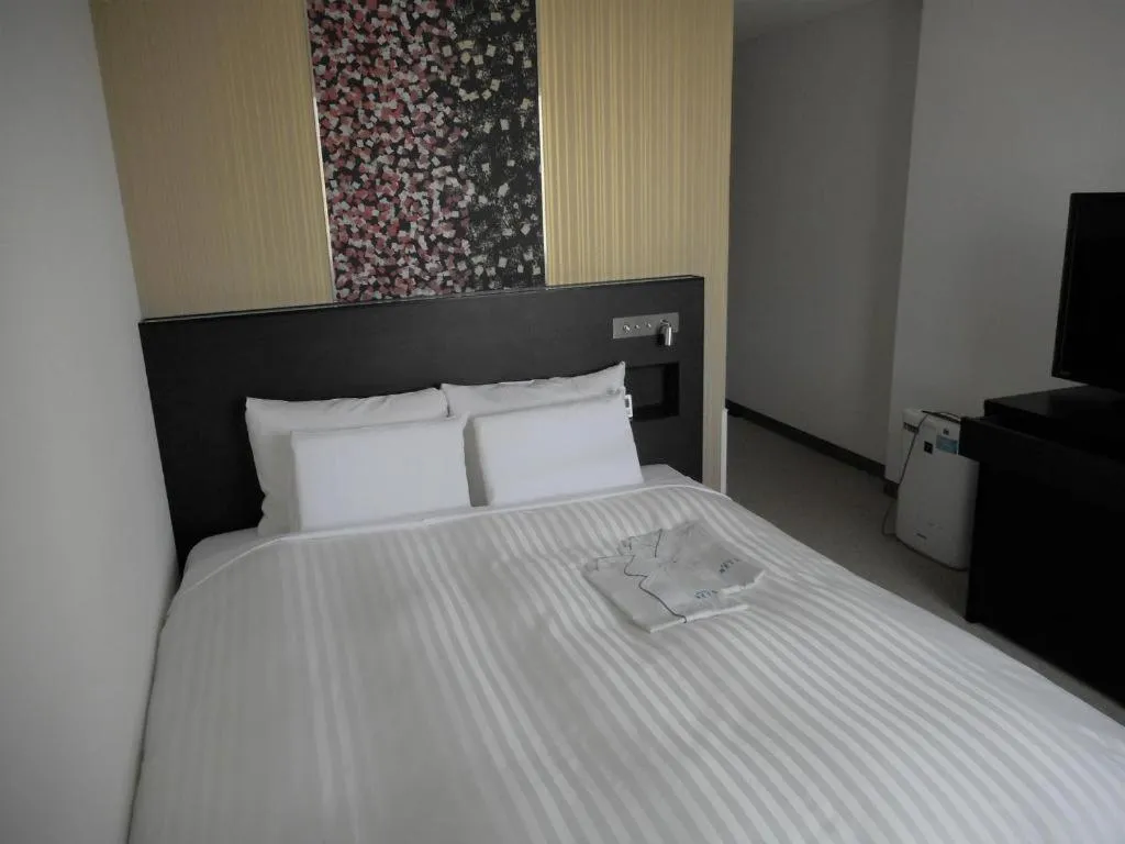 Bed in JR-EAST HOTEL METS NAGAOKA