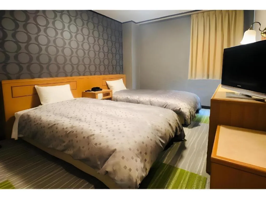 Bed in Urban Place Inn Kokura