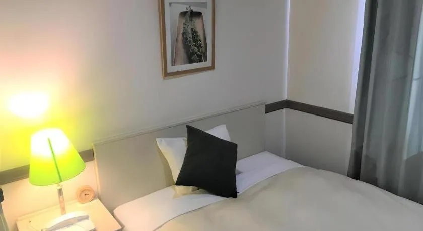 Bed in Matsumoto Wellton Hotel