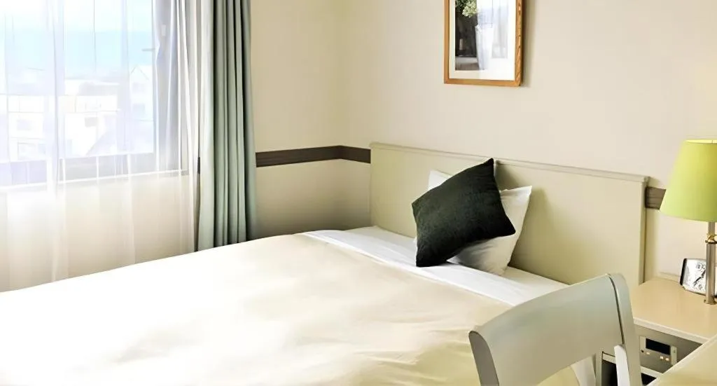 Bed in Matsumoto Wellton Hotel