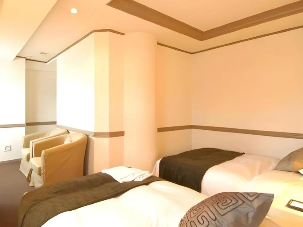 Bed in Matsumoto Wellton Hotel