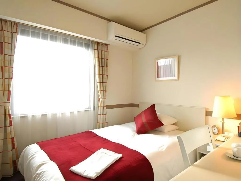 Bed in Matsumoto Wellton Hotel