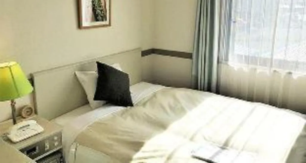 Bed in Matsumoto Wellton Hotel