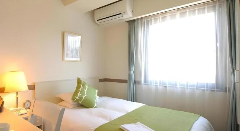 Bed in Matsumoto Wellton Hotel