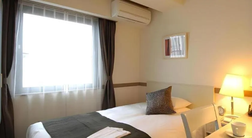 Bed in Matsumoto Wellton Hotel