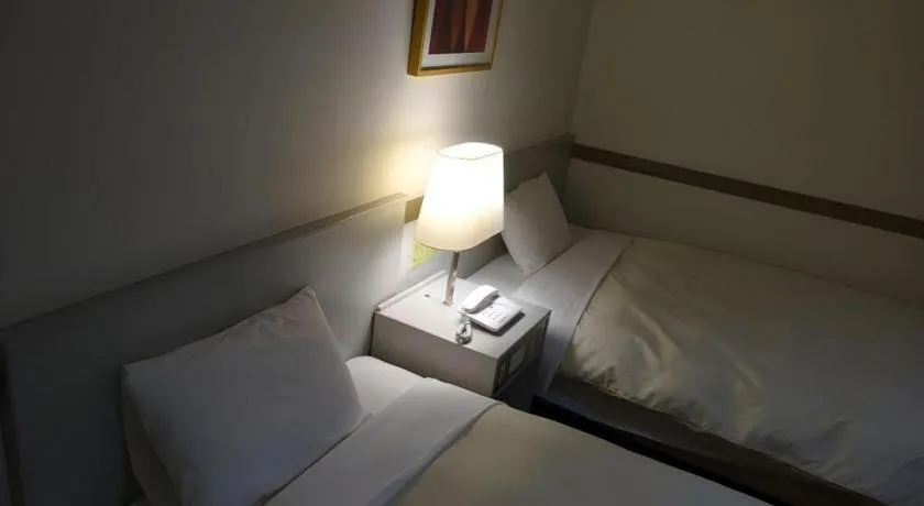 Bed in Matsumoto Wellton Hotel