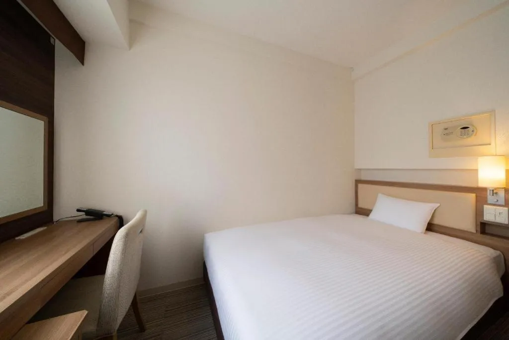 Bed in Hotel Oriental Express Nagoya Sakae