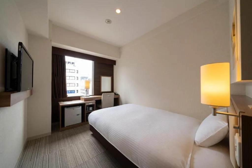 Bed in Hotel Oriental Express Nagoya Sakae