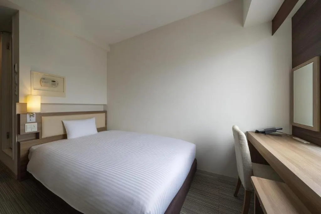 Bed in Hotel Oriental Express Nagoya Sakae