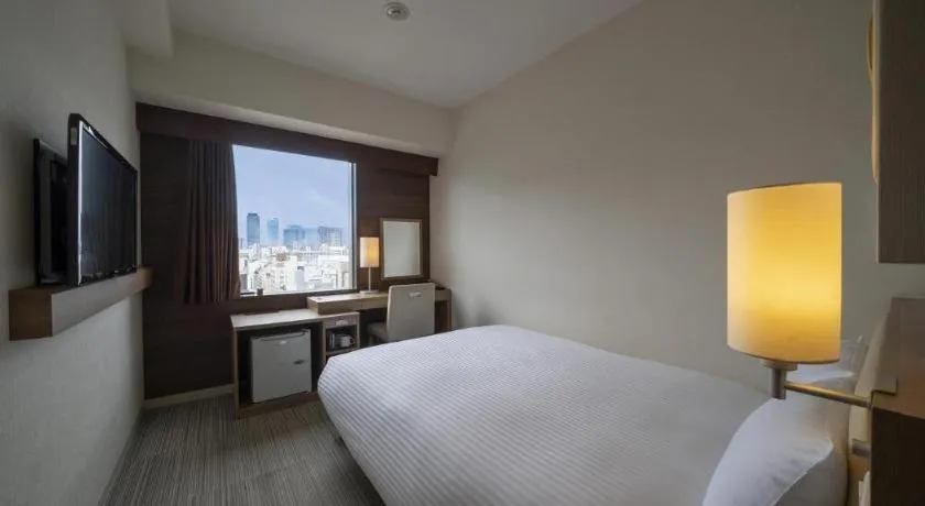 Bed in Hotel Oriental Express Nagoya Sakae