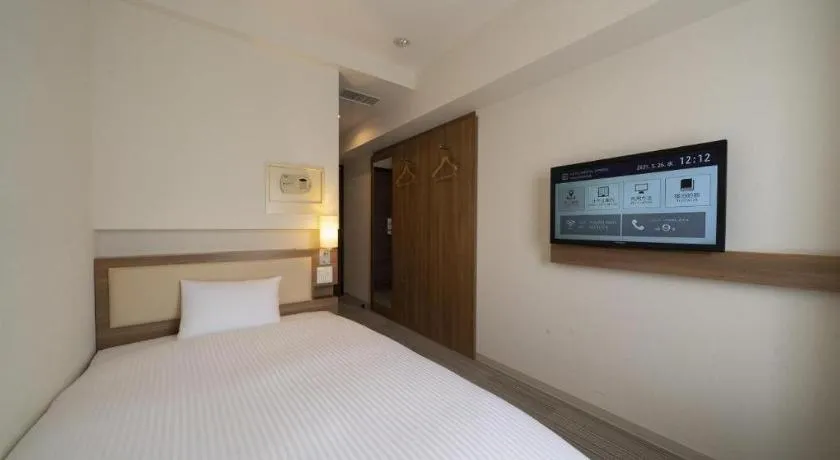 Bed in Hotel Oriental Express Nagoya Sakae