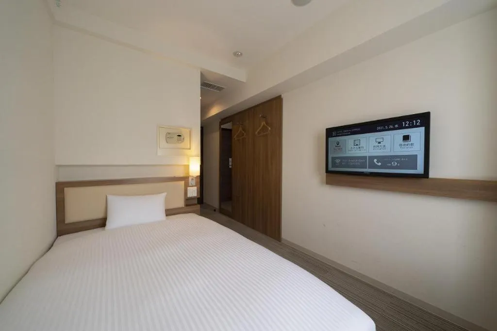 Bed in Hotel Oriental Express Nagoya Sakae