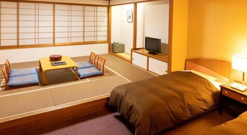 Bed in Oze Iwakura Resort Hotel