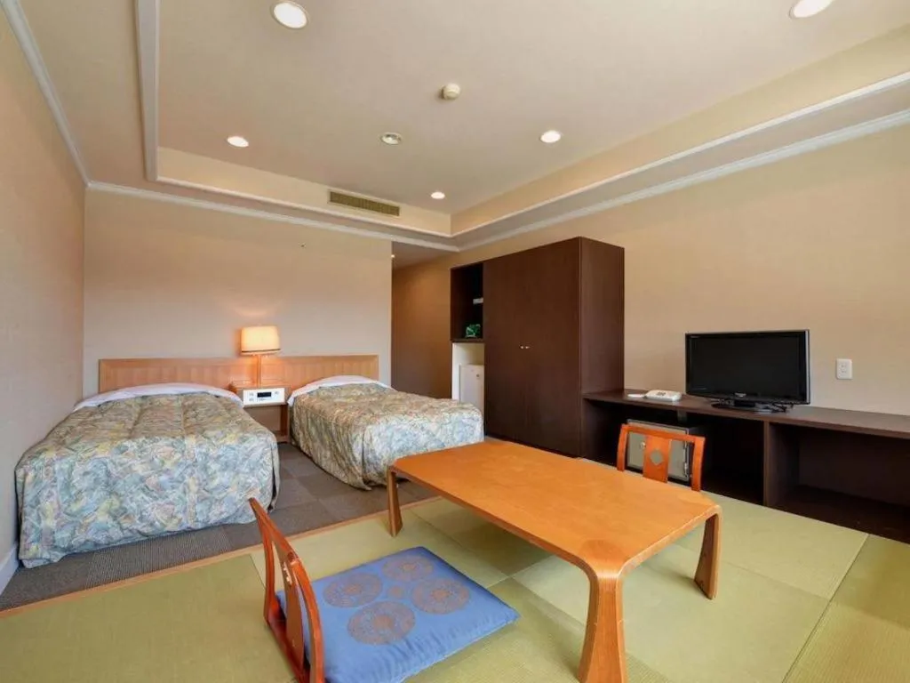 Bed in Oze Iwakura Resort Hotel