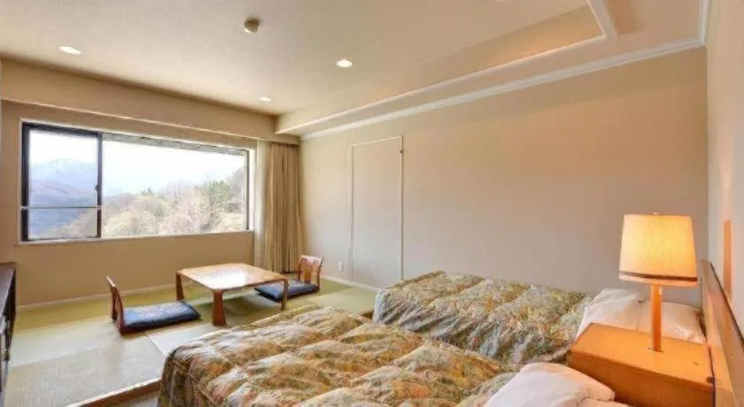 Bed in Oze Iwakura Resort Hotel