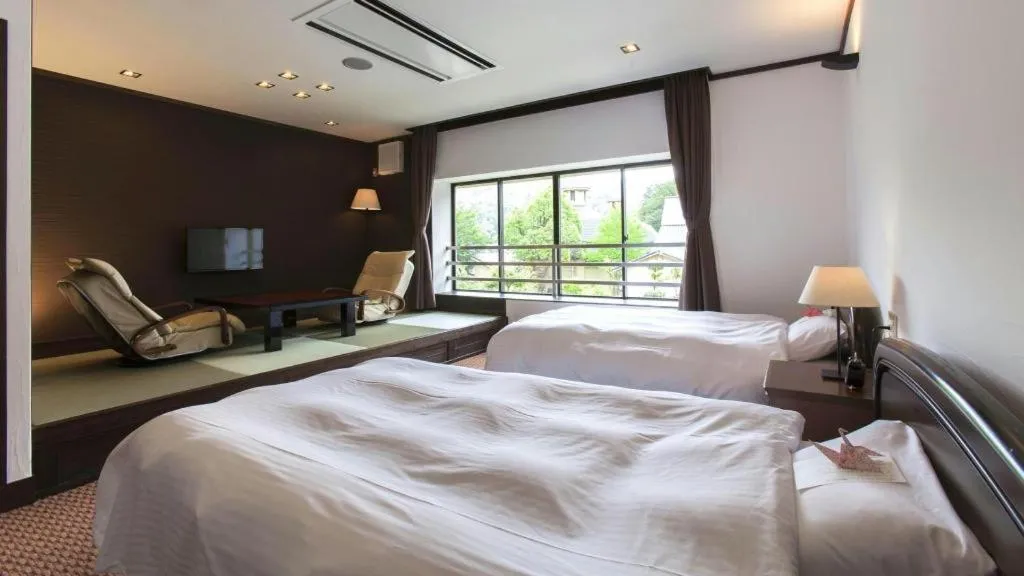 Bed in Hotel Silk Onsen Yamabiko