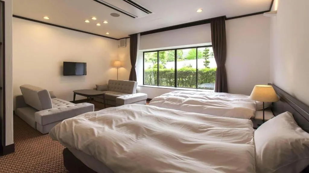 Bed in Hotel Silk Onsen Yamabiko