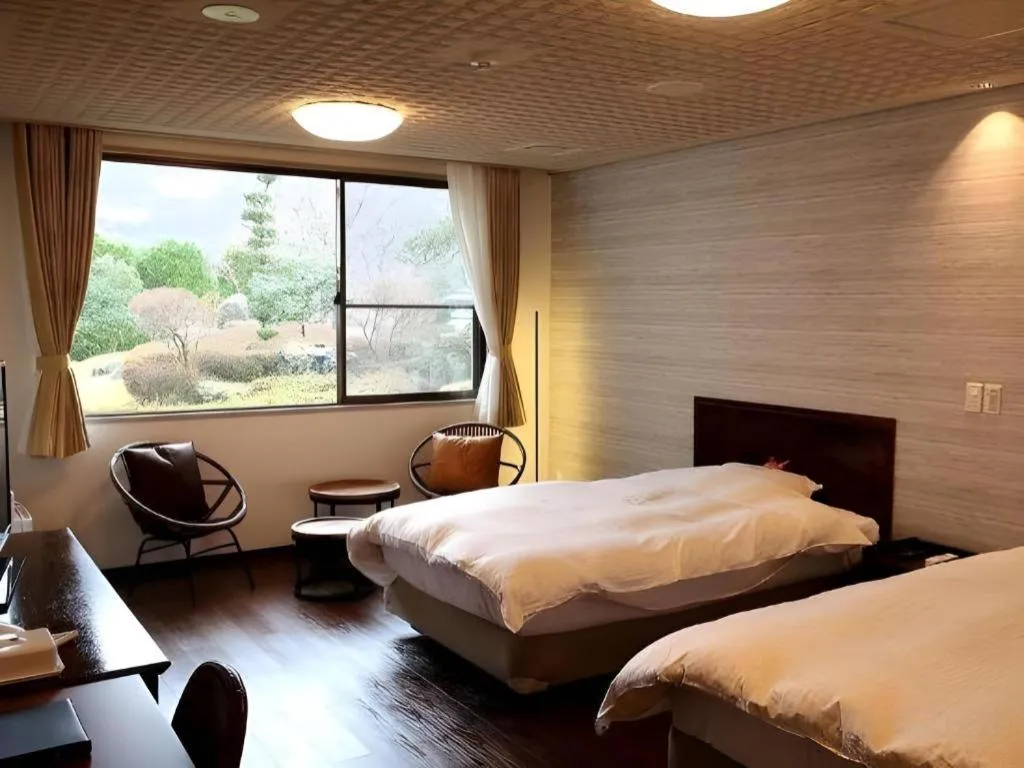 Bed in Hotel Silk Onsen Yamabiko