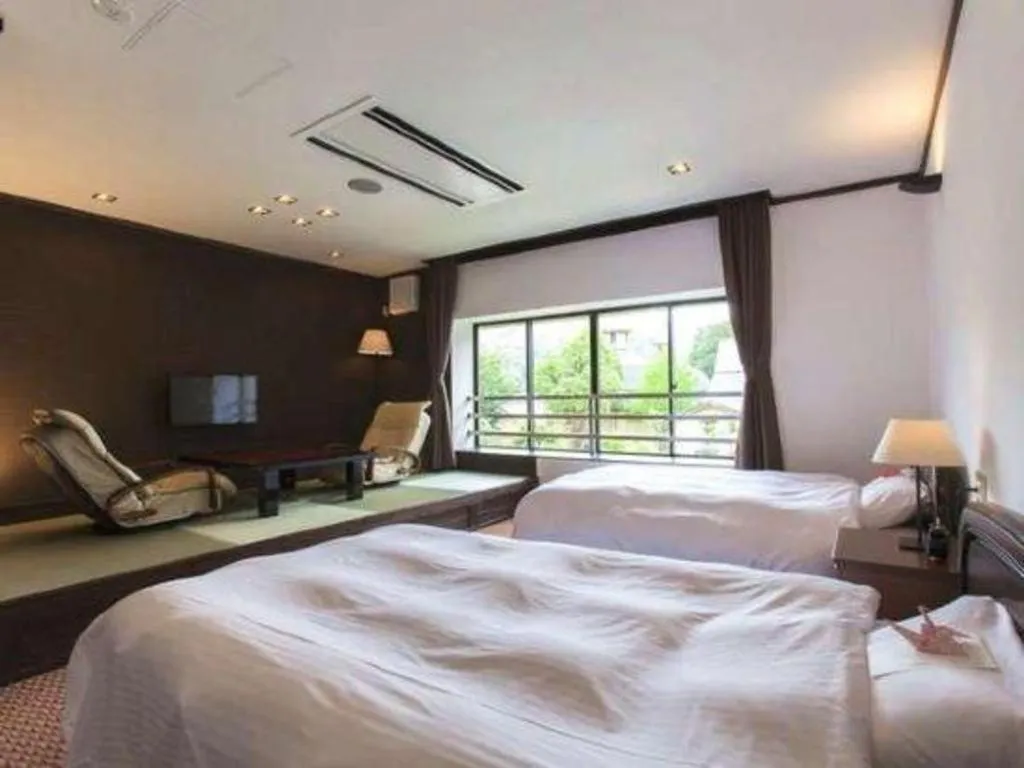 Bed in Hotel Silk Onsen Yamabiko