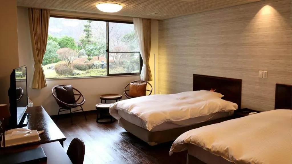 Bed in Hotel Silk Onsen Yamabiko