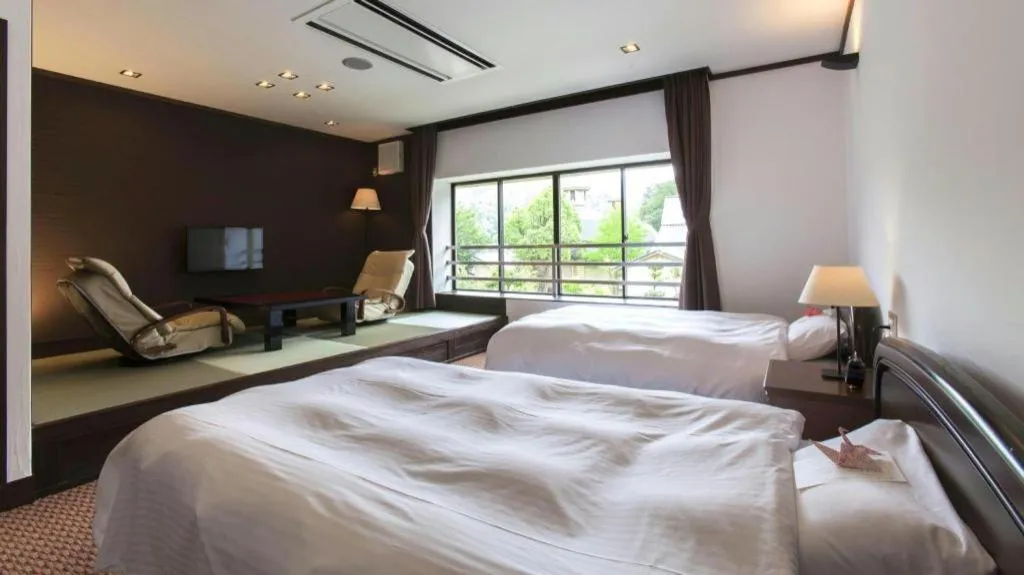 Bed in Hotel Silk Onsen Yamabiko