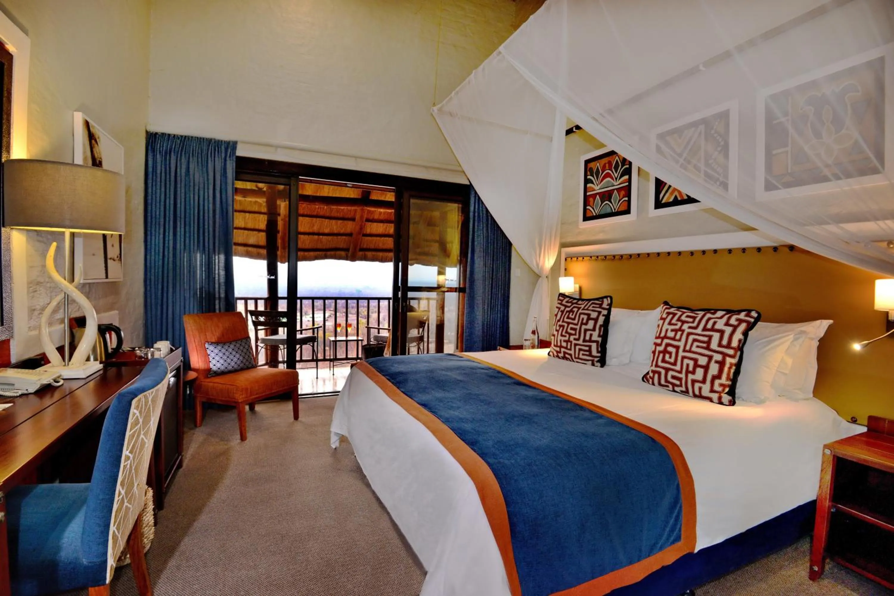 Photo of the whole room, Bed in Victoria Falls Safari Lodge