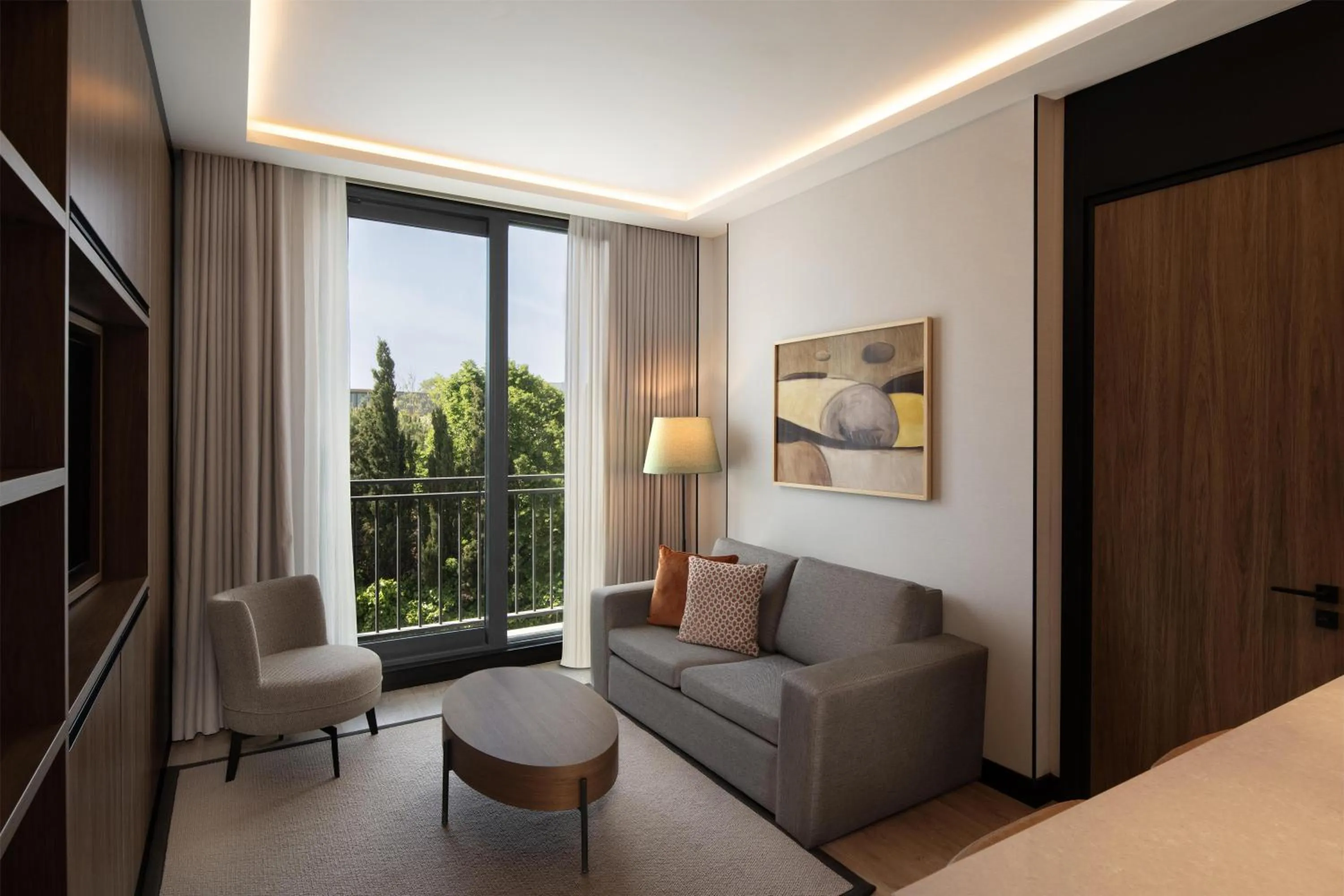 Living room, Bed in Altunizade Suites Istanbul, Curio Collection By Hilton