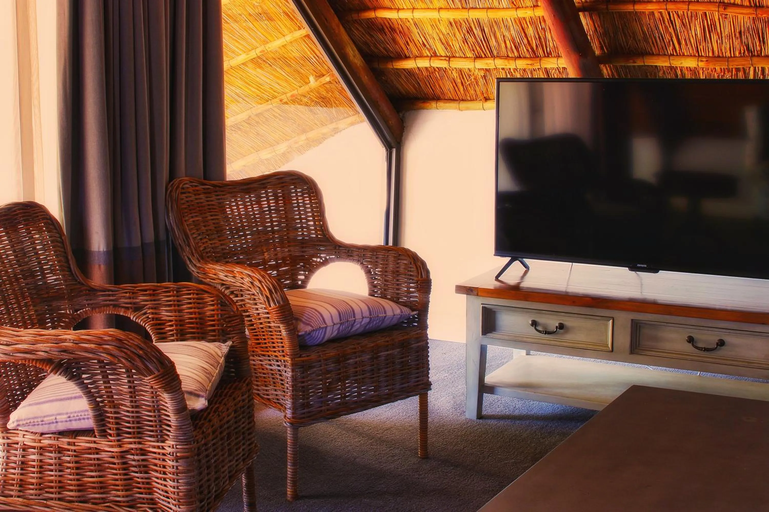 Communal lounge/ TV room in Clivia Lodge