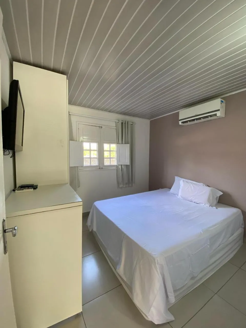 Bed in Pousada Kaluanã