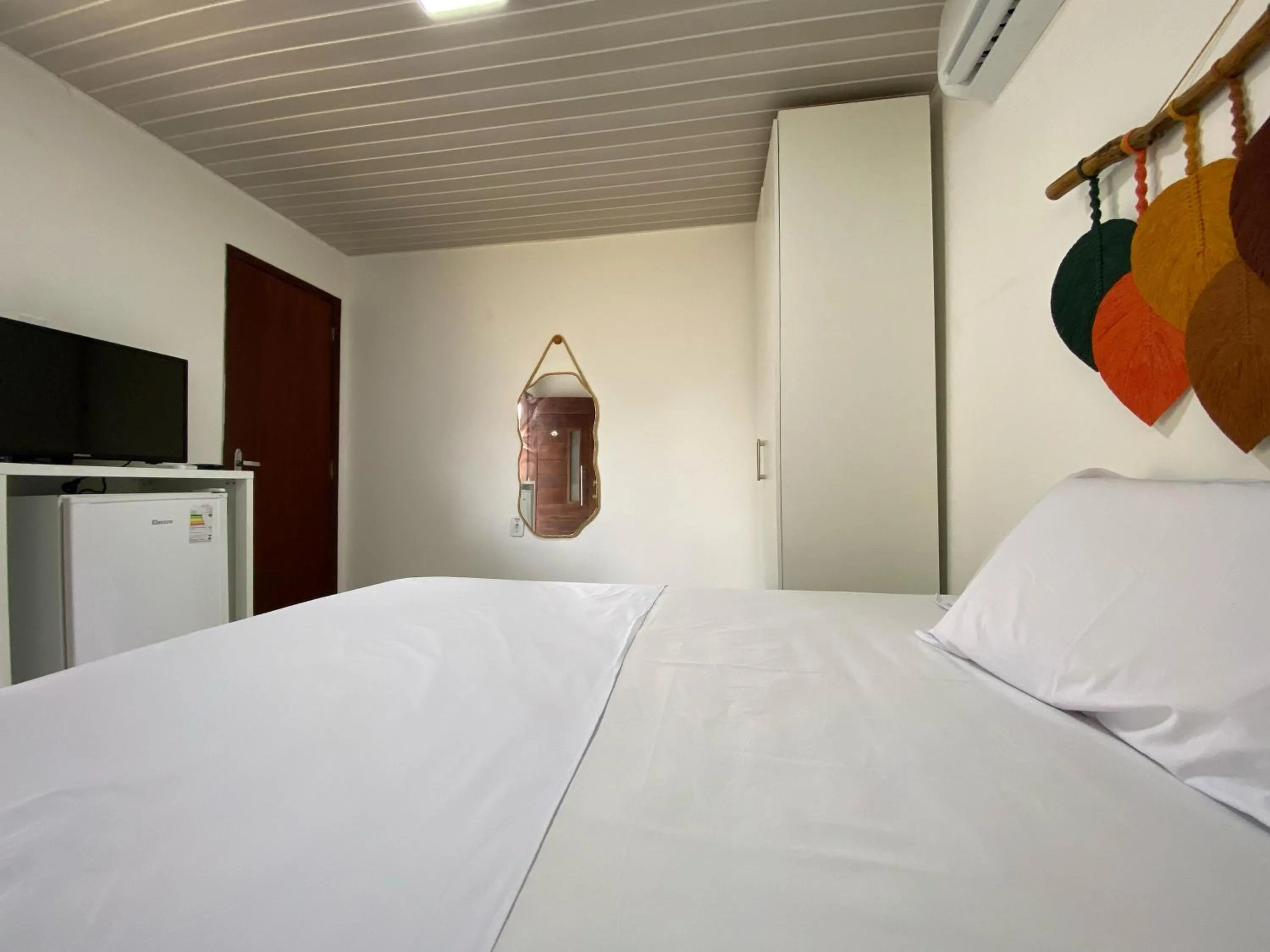 Bed in Pousada Kaluanã