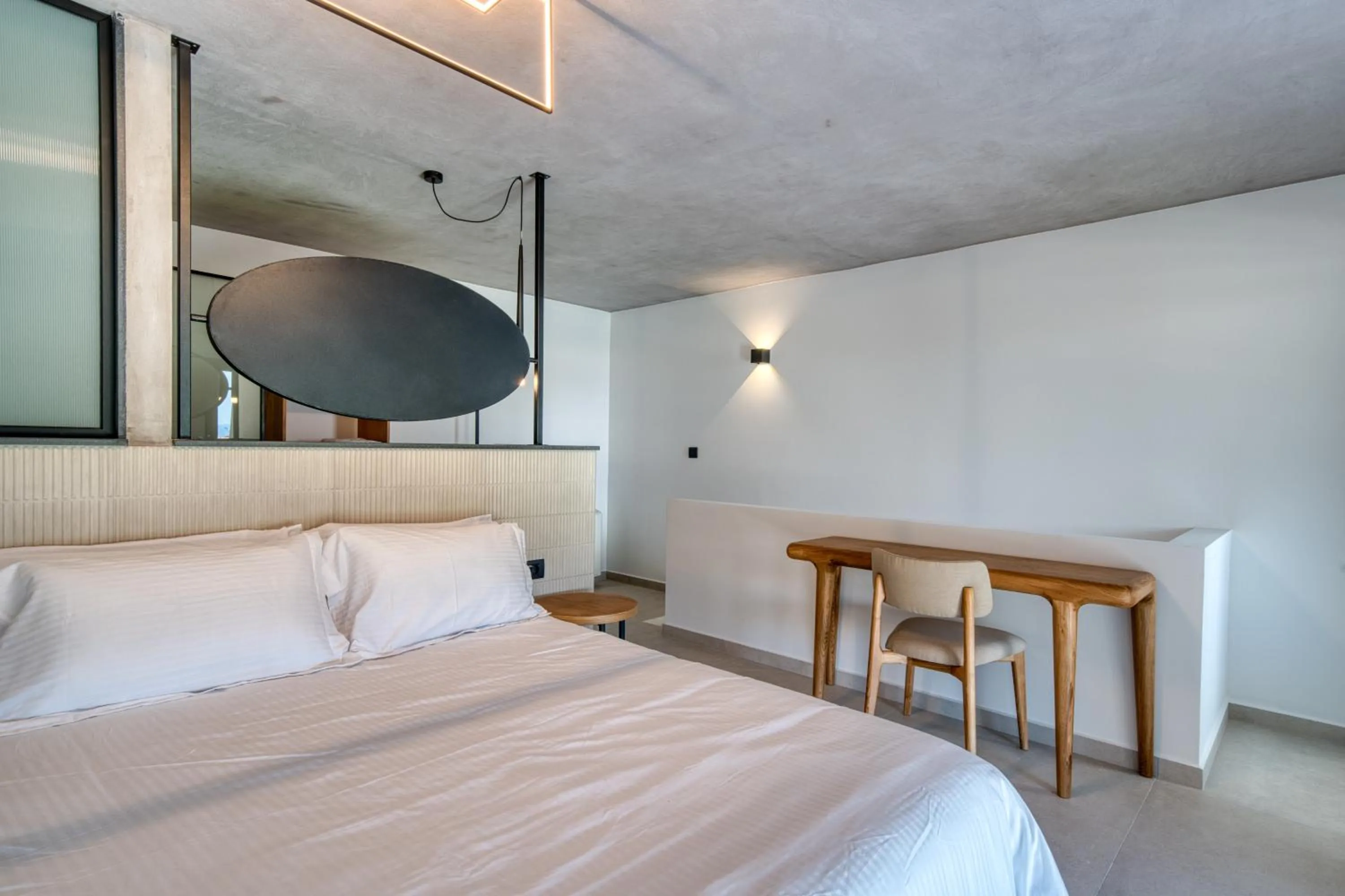 Bed in Anima Deluxe Suites