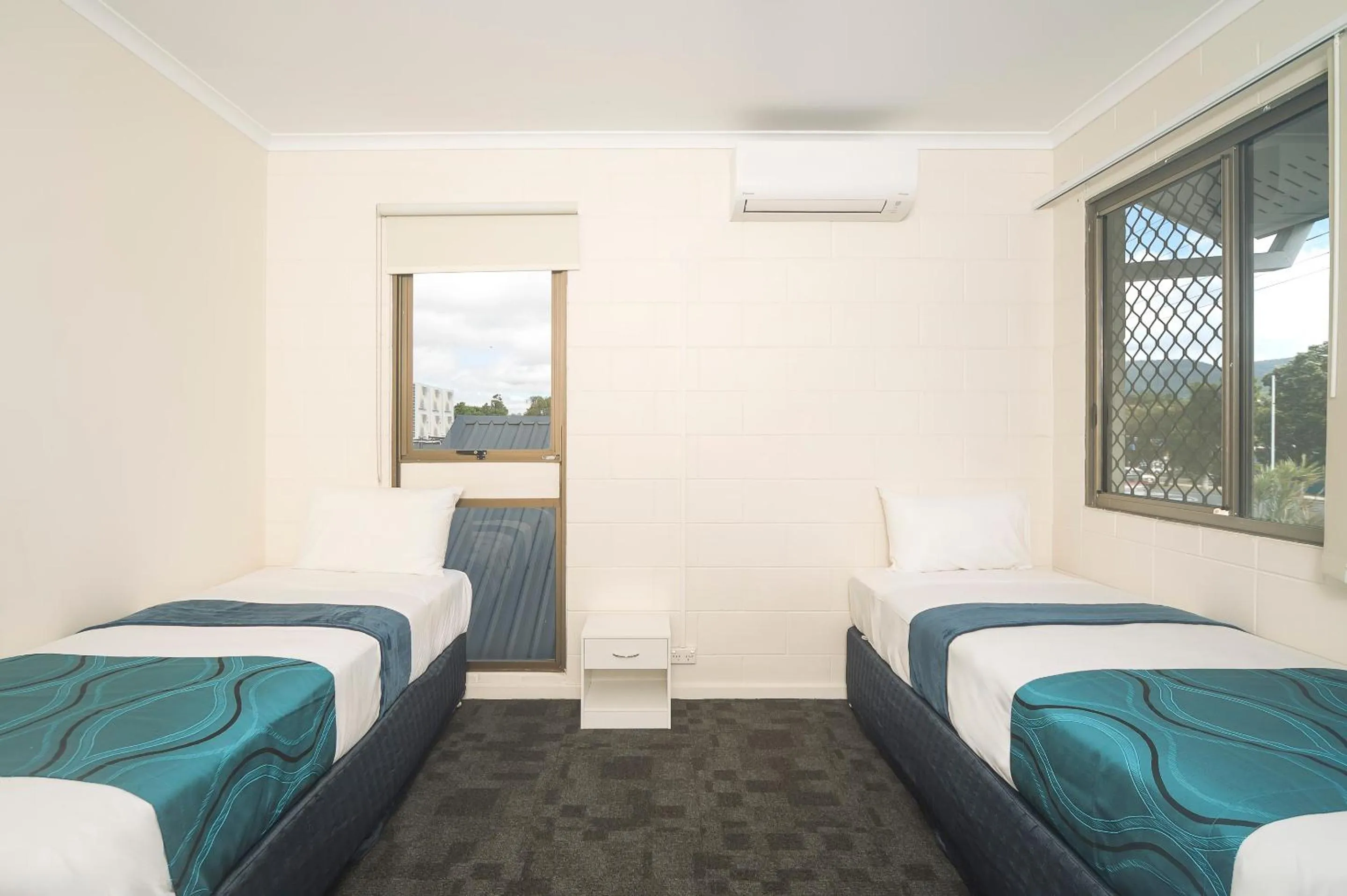 Bed in Reef Gateway Hotel